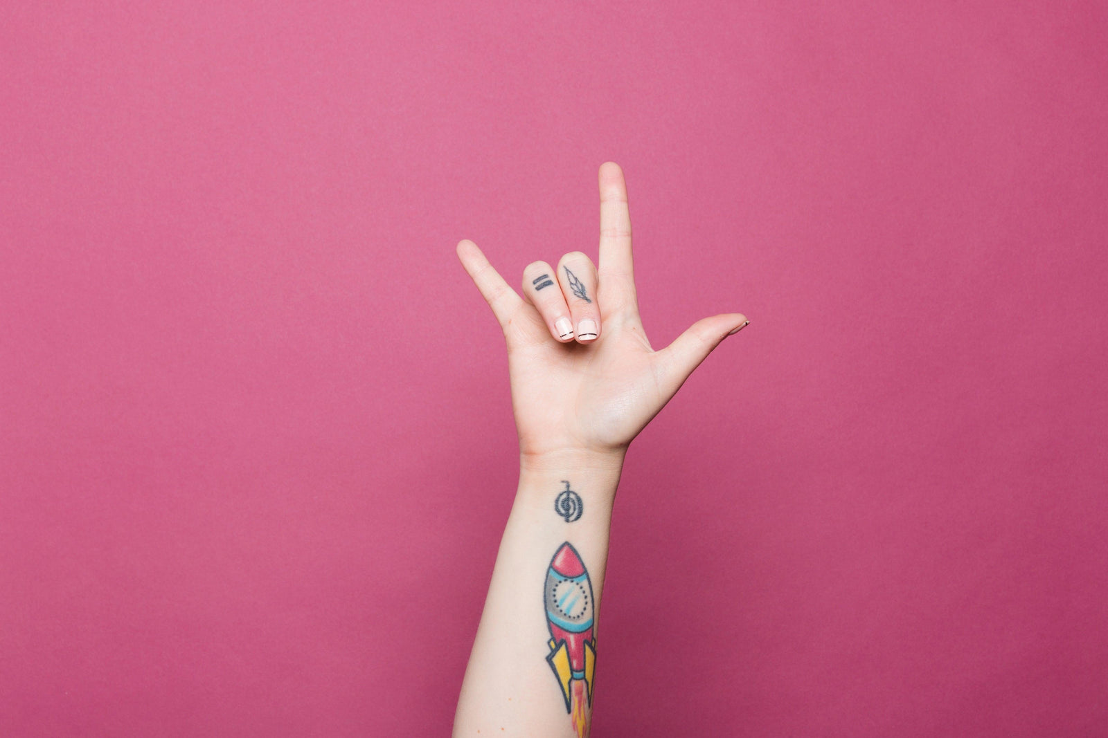 a-tattooed-hand-doing-the-sign-for-i-love-you - Ready Sweat Go