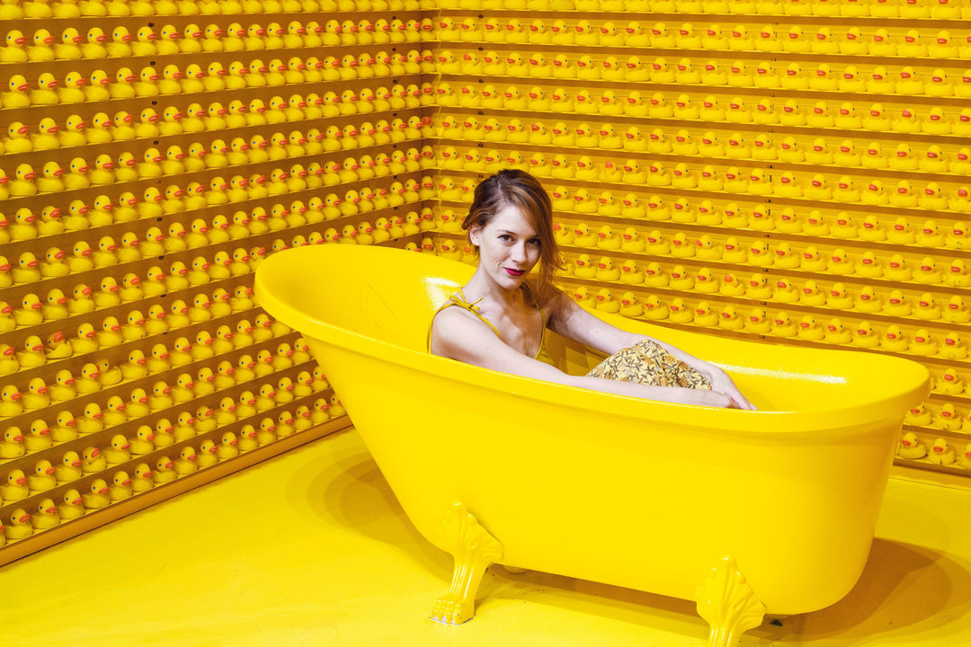 sitting-in-the-bath-in-a-yellow-room - Ready Sweat Go